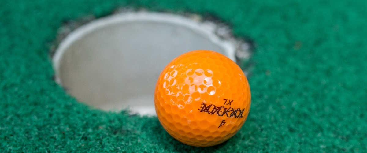 golf ball near cup